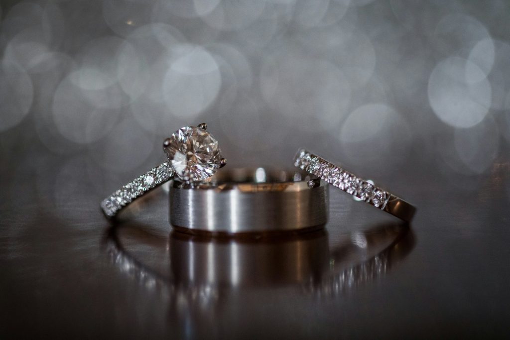 a couple of wedding rings sitting on top of a table